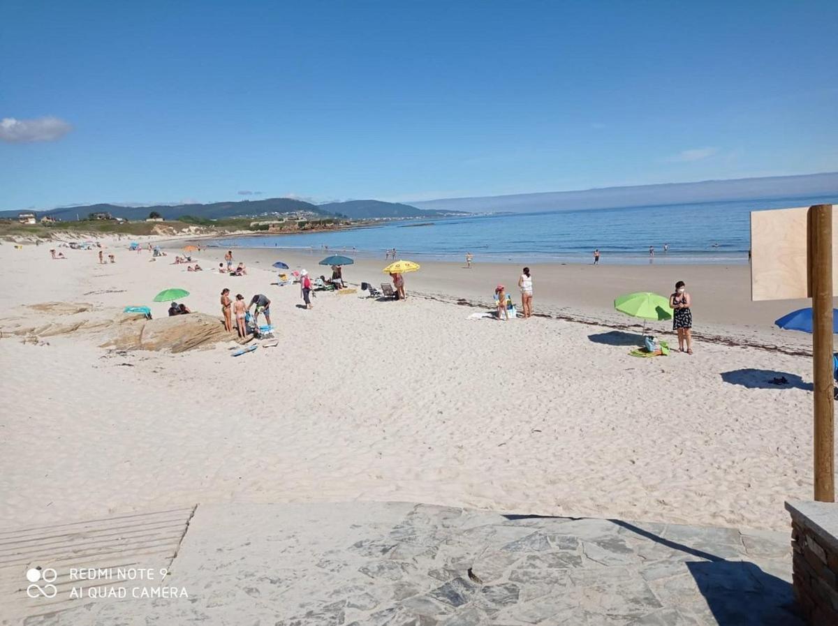 Enfoz Con Parking Y A La Orilla Del Mar Foz Exterior foto